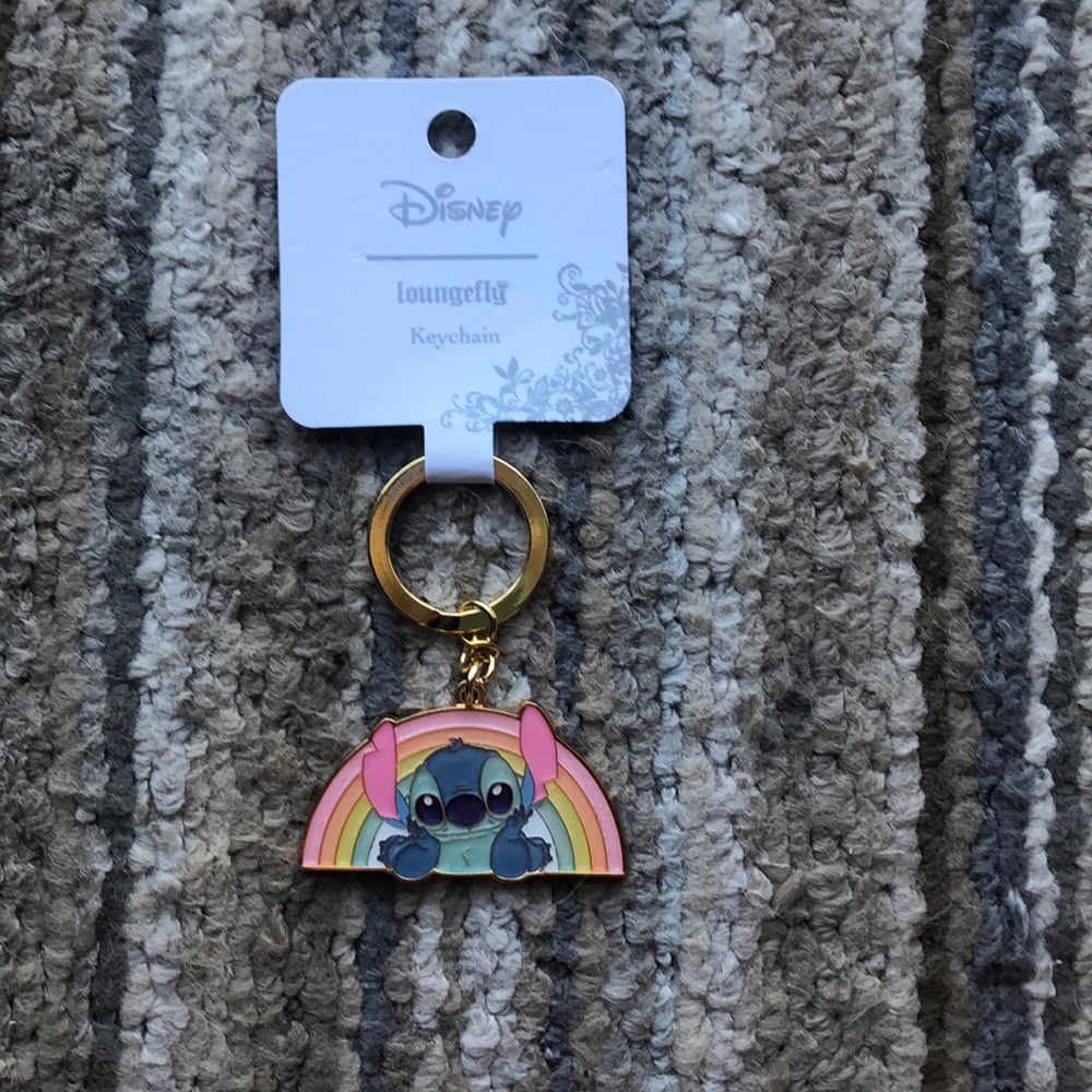 Stitch keychain with a rain bow